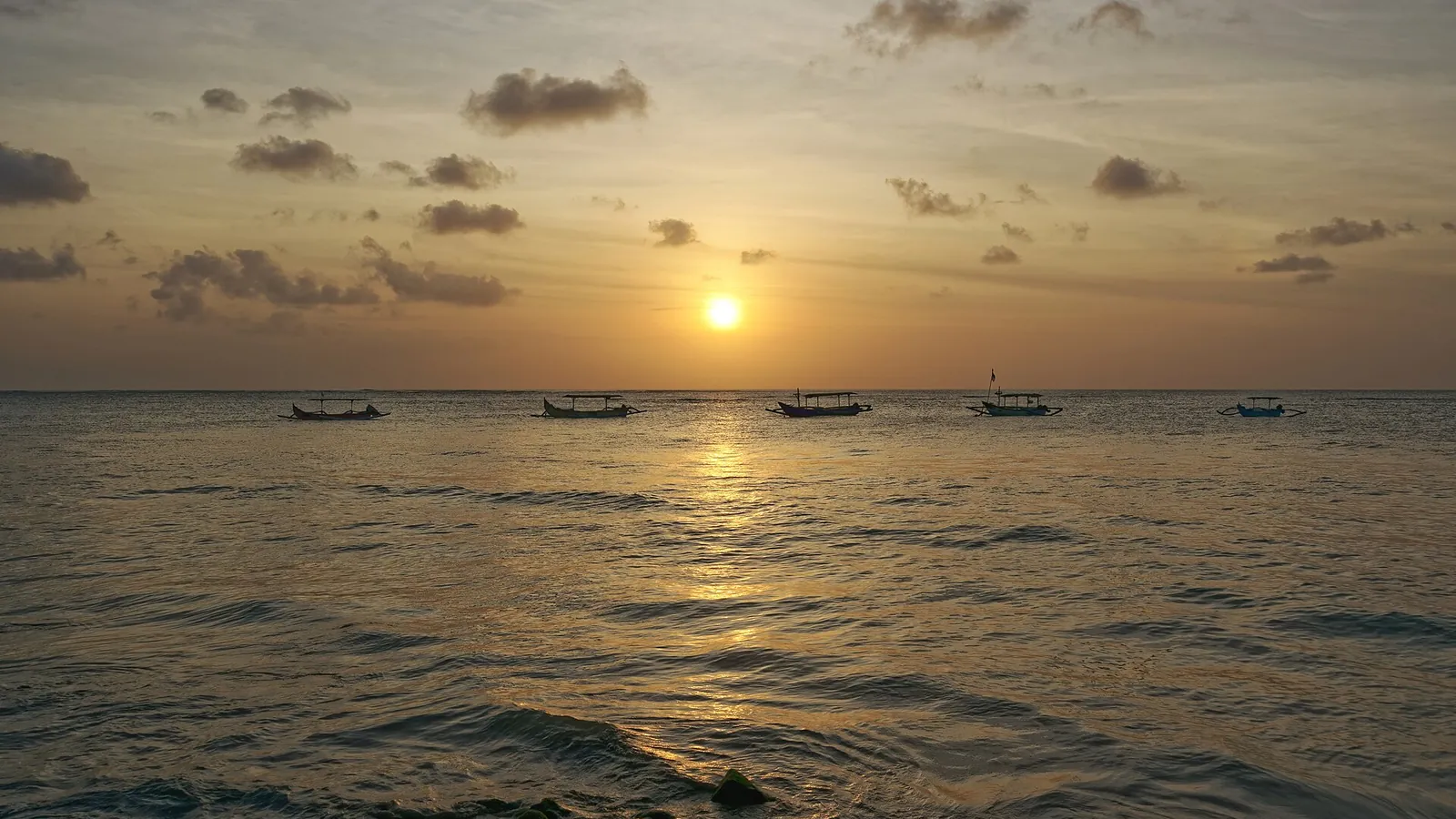 Sunset over the ocean at Kuta Beach, Bali