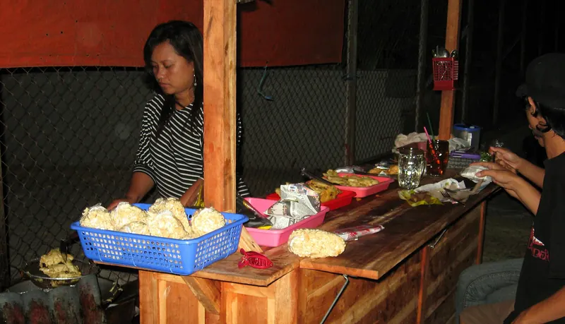A street-side angkringan food cart in Yogyakarta