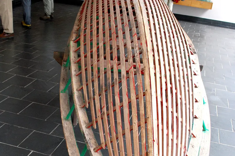 A traditional Irish currach boat on the water