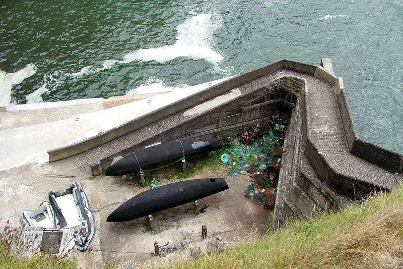 Traditional currach boats at Dunquin Pier on the Dingle Peninsula