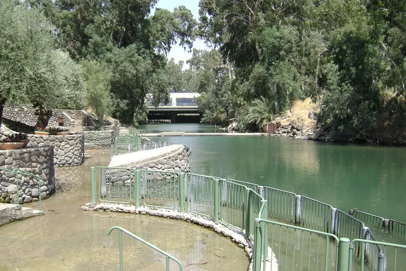 Pilgrims in white robes at the Yardenit baptism site on the Jordan River