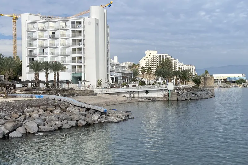 The still waters of the Sea of Galilee at Tiberias with hills beyond