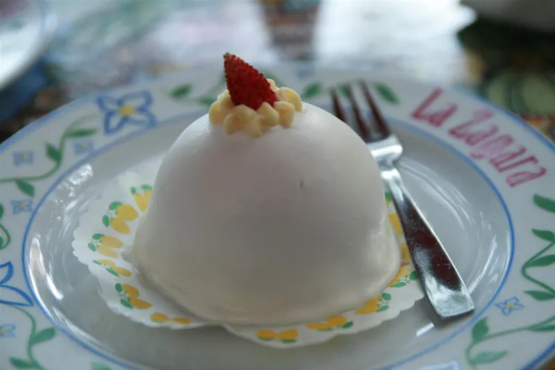 A delizia al limone dome cake soaked in lemon syrup and cream
