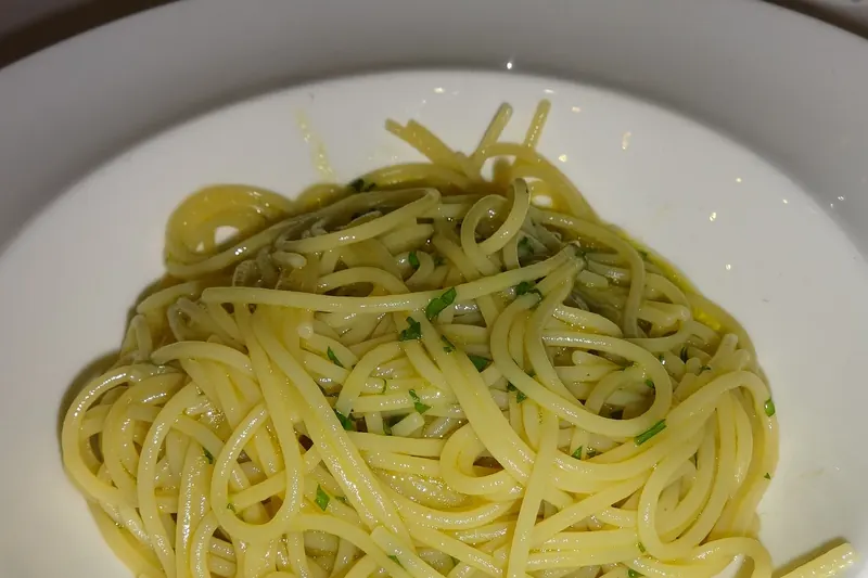 A small bottle of colatura di alici, Cetara's amber anchovy sauce