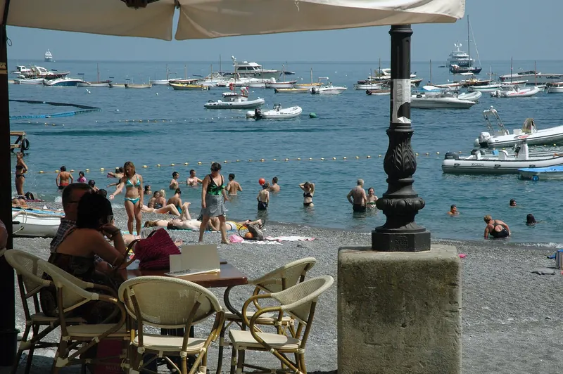 Boats moored in the bay below Positano's stacked houses