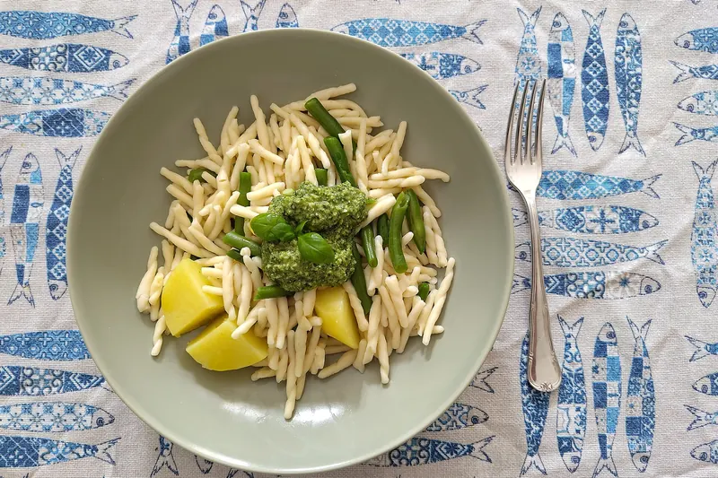 Trofie pasta dressed in pesto genovese, made with basil, pine nuts and Parmesan
