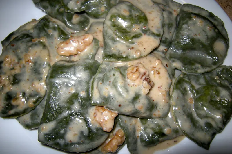 Pansotti ravioli stuffed with wild greens and ricotta, dressed with walnut sauce