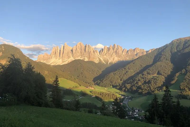 The small church of Santa Maddalena set in meadow against the spires of the Odle