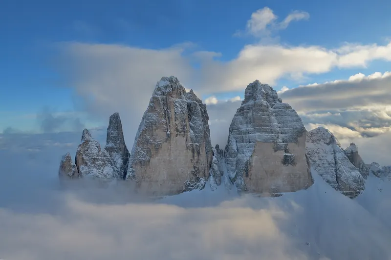 The three vertical rock towers of the Tre Cime di Lavaredo rising above alpine scree