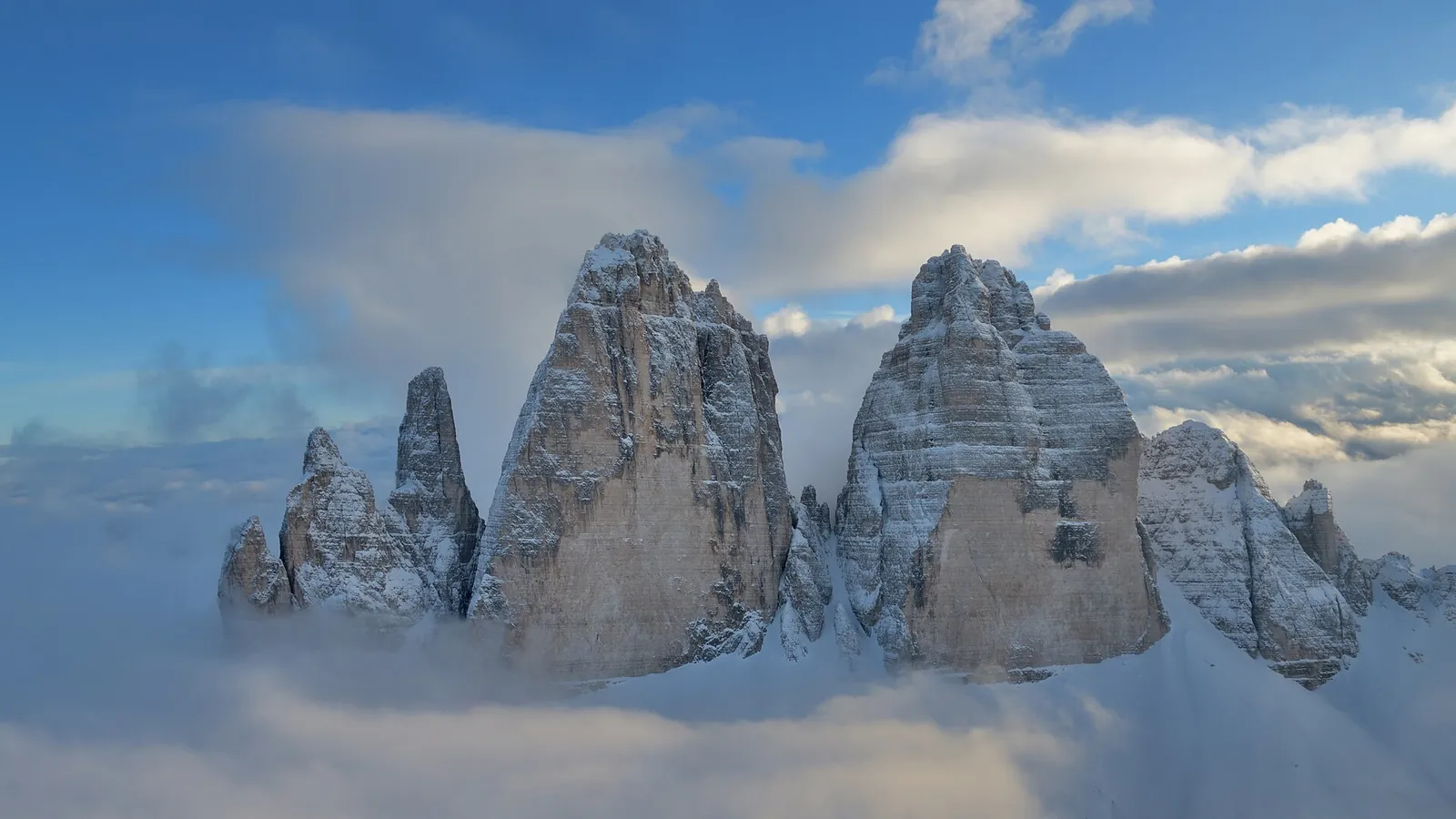 The three vertical rock towers of the Tre Cime di Lavaredo rising above alpine scree