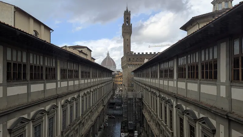 The colonnaded courtyard of the Uffizi Gallery running towards the Arno