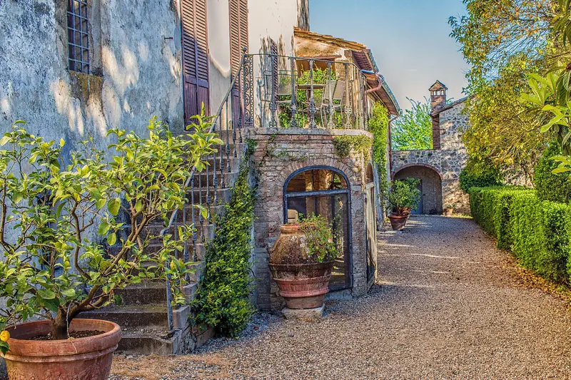 A stone Chianti winery among its own vineyards