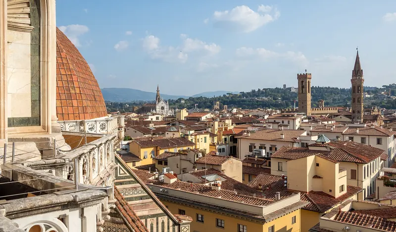 Florence's terracotta rooftops and towers seen from the terrace of the cathedral dome