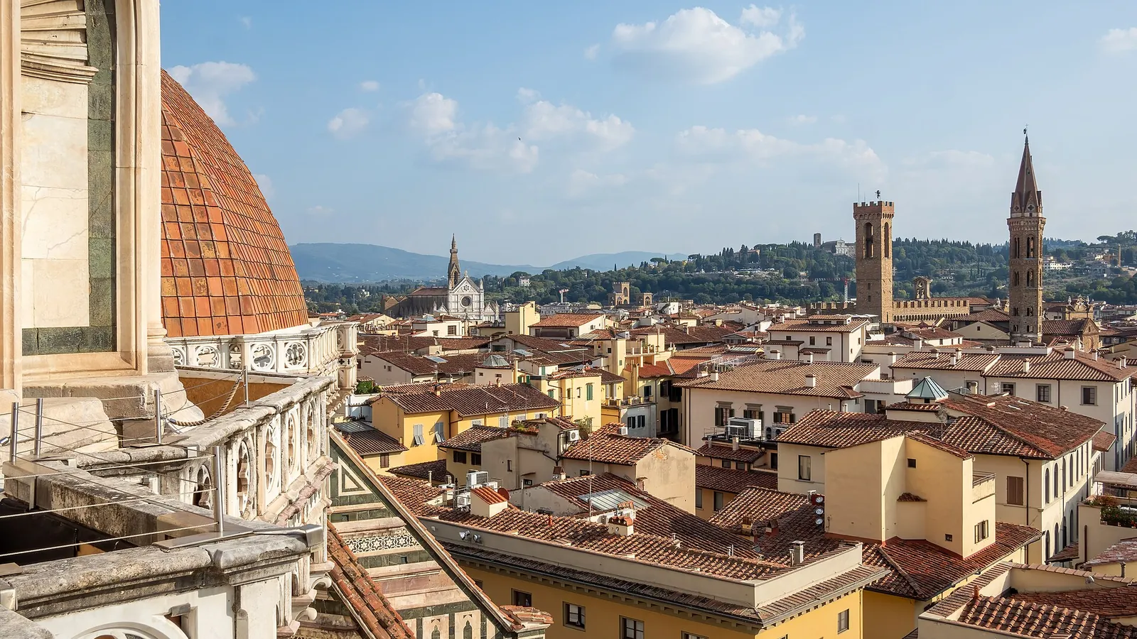 Florence's terracotta rooftops and towers seen from the terrace of the cathedral dome