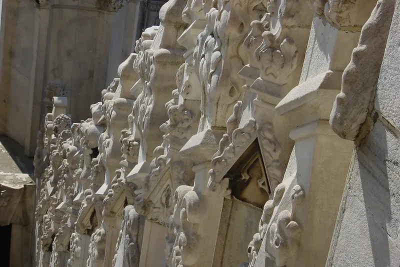 Visitors on the marble roof terraces of Milan's Duomo among the spires