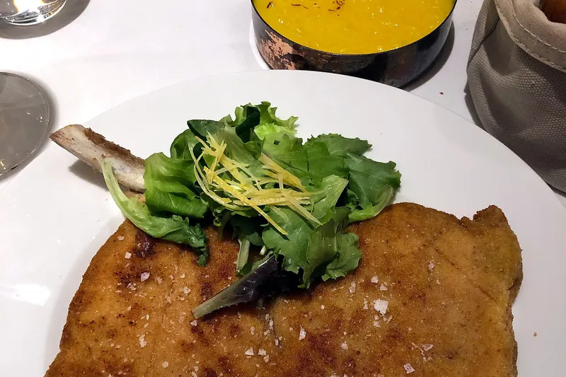 Cotoletta alla milanese, a bone-in veal chop breaded and fried in butter