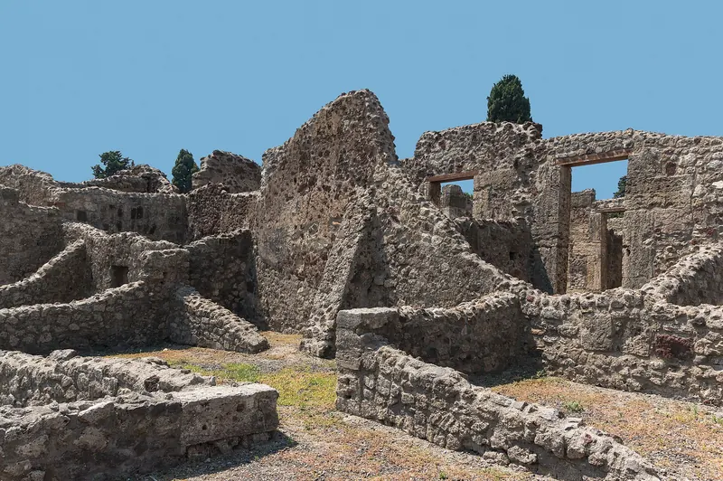 The paved streets and ruined buildings of Pompeii