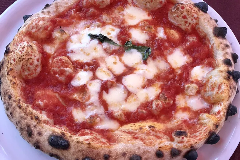 A leopard-spotted Neapolitan pizza