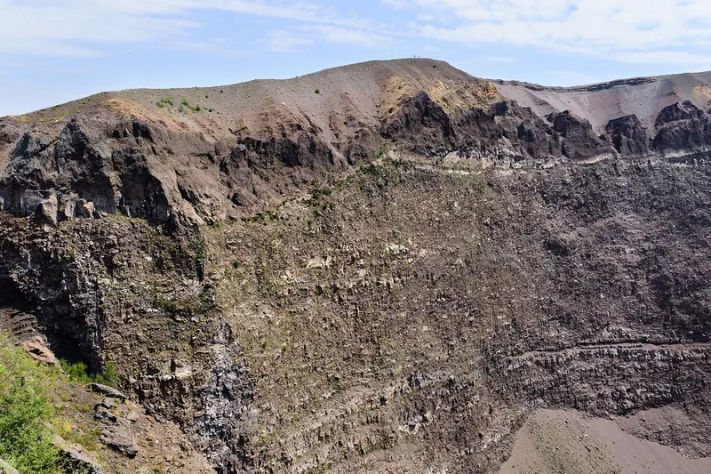 Walkers on the gravel path along the crater rim of Vesuvius