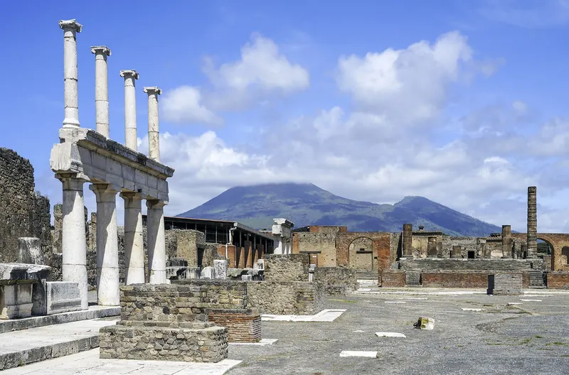 The colonnaded forum of Pompeii with Mount Vesuvius rising behind it