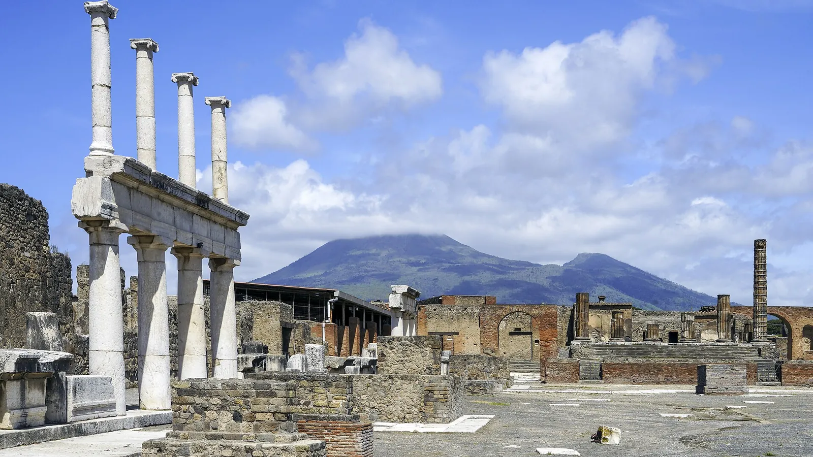 The colonnaded forum of Pompeii with Mount Vesuvius rising behind it