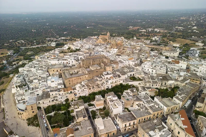 Ostuni's lime-washed white town on its hill above the olive plain