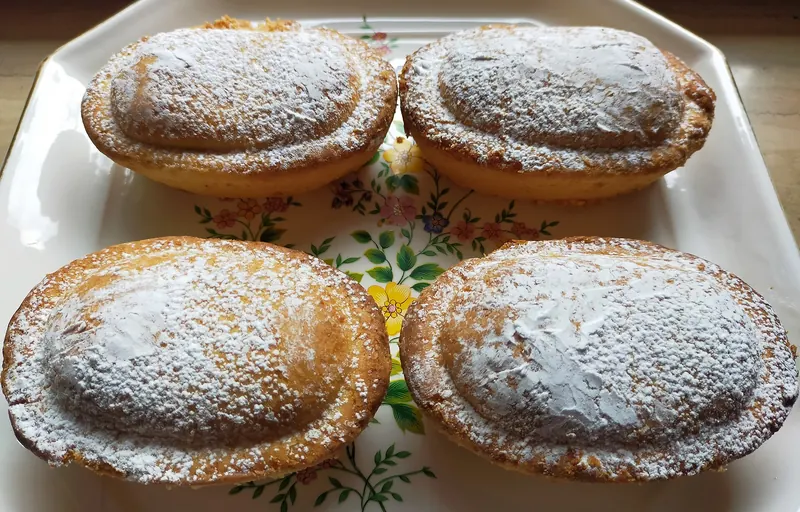 A pasticciotto, shortcrust pastry filled with custard and sour cherry