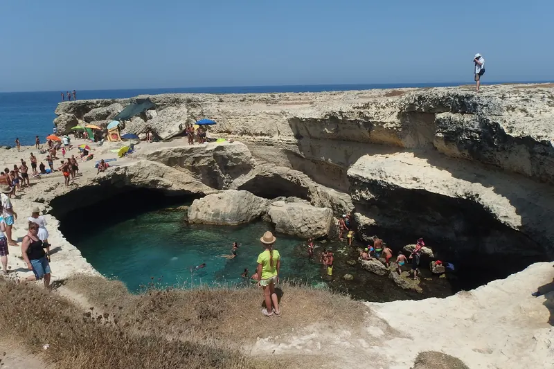 The natural sinkhole pool of the Grotta della Poesia near Roca