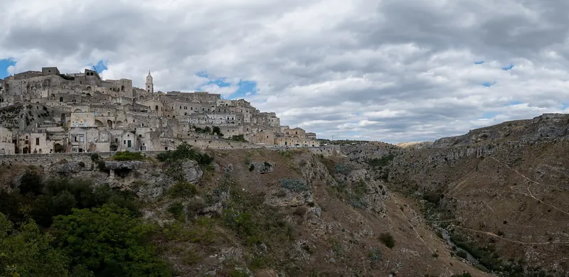 The stone cave dwellings of the Sassi di Matera stacked up the side of a ravine