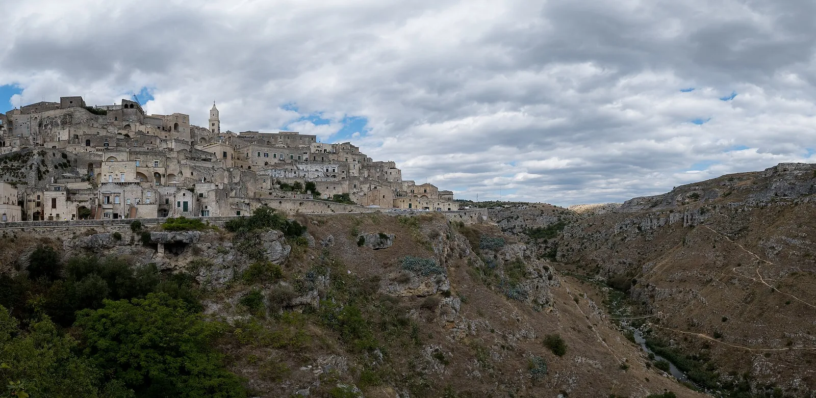 The stone cave dwellings of the Sassi di Matera stacked up the side of a ravine