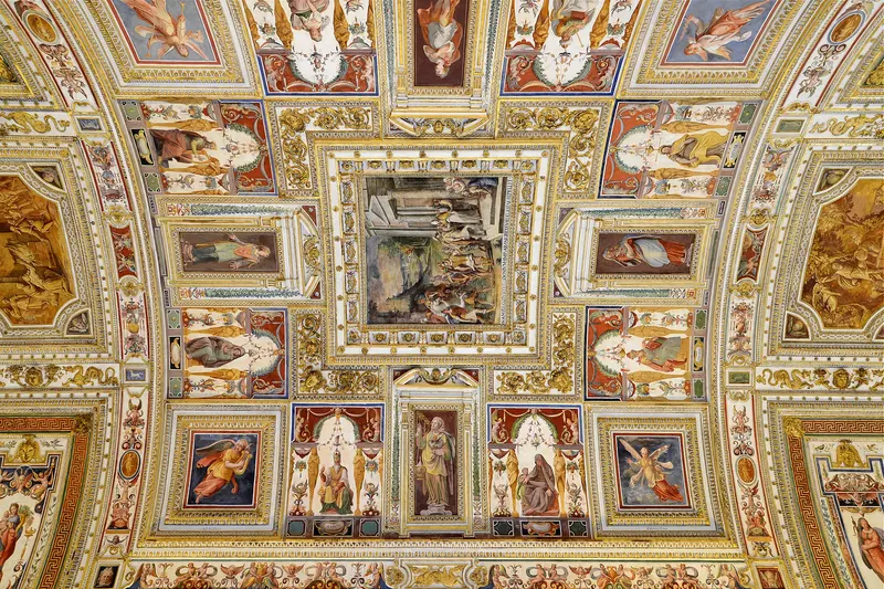The ornately frescoed vaulted ceiling of the Gallery of Maps inside the Vatican Museums