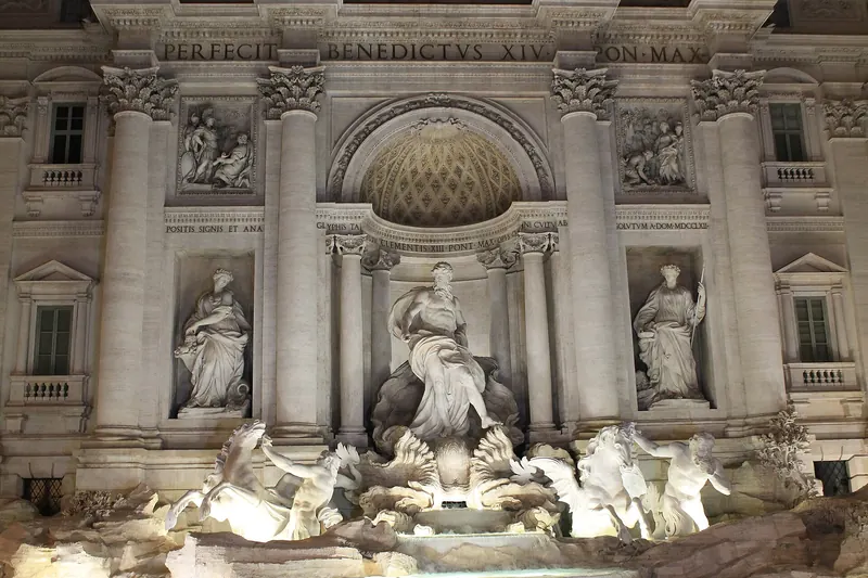 The Trevi Fountain floodlit and nearly empty at night