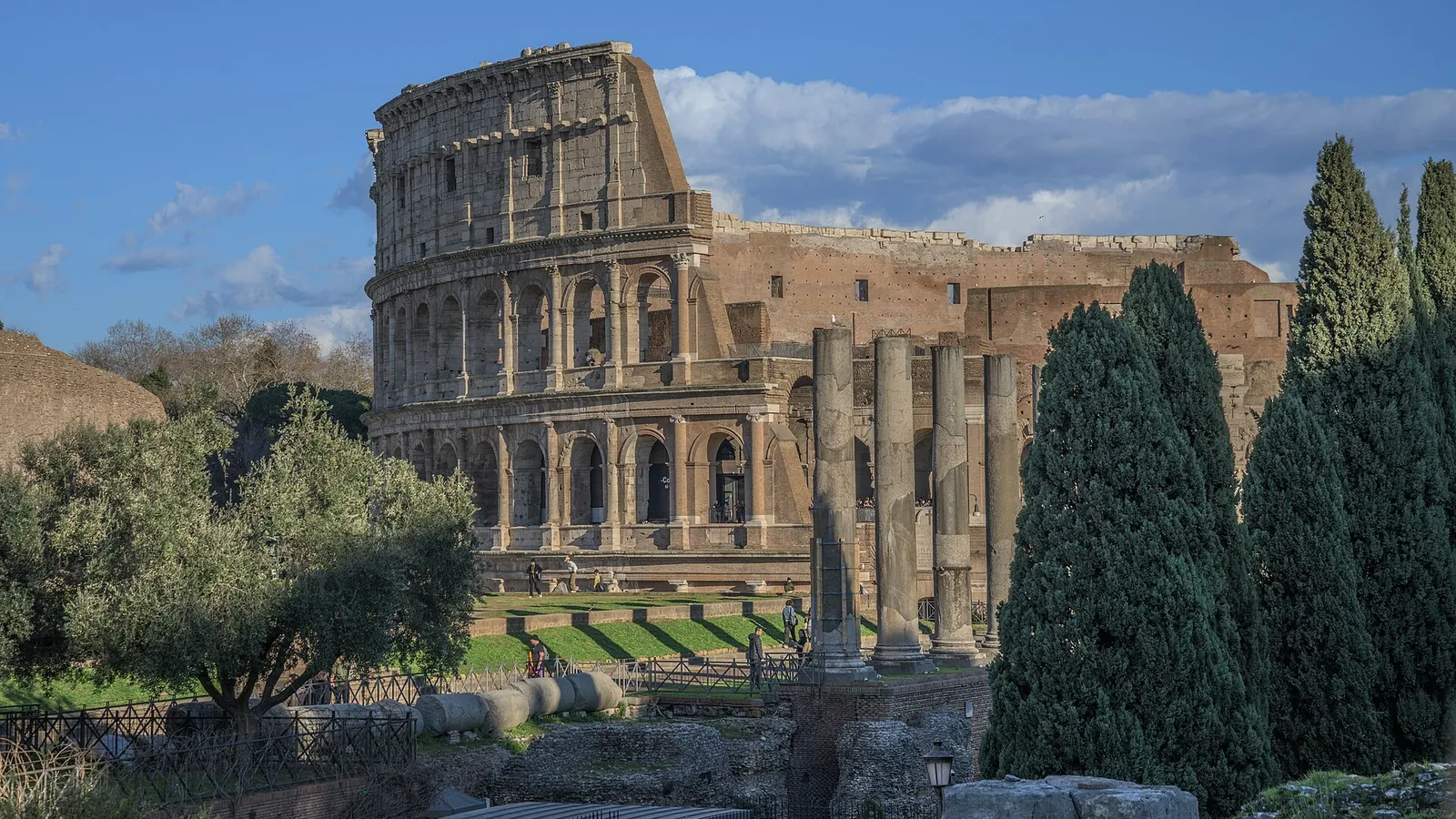 The Colosseum seen across the ruins of the Roman Forum