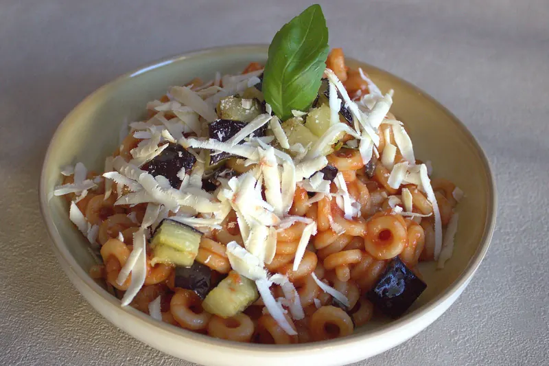 Pasta alla Norma, with fried aubergine, tomato and salted ricotta
