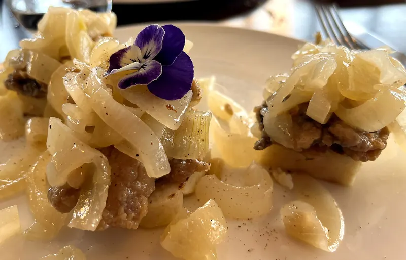A plate of sarde in saor, sardines marinated with sweated onions