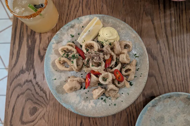 A plate of fried calamari rings, the everyday version of Venice's fritto misto