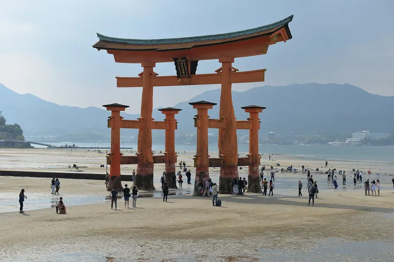 Itsukushima Shrine's torii gate partially submerged at high tide