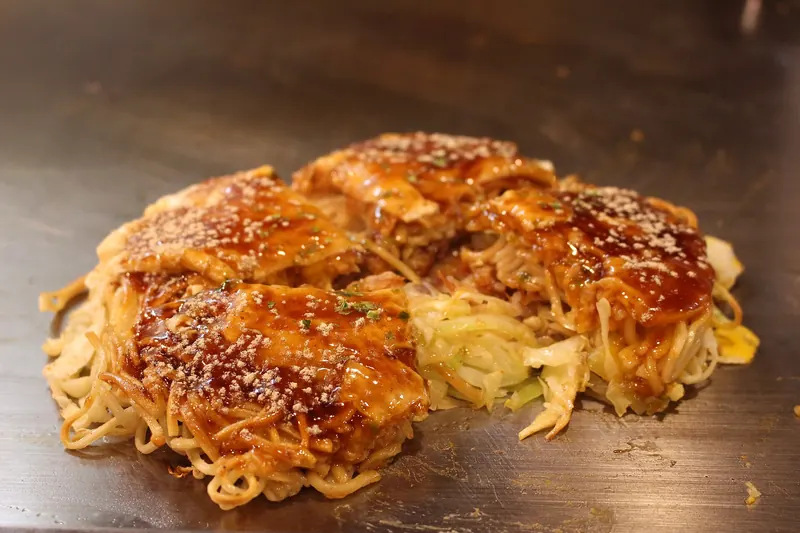 A finished Hiroshima-style okonomiyaki on the teppan grill