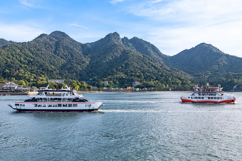 The ferry approaching Miyajima with the torii gate and Mount Misen in view