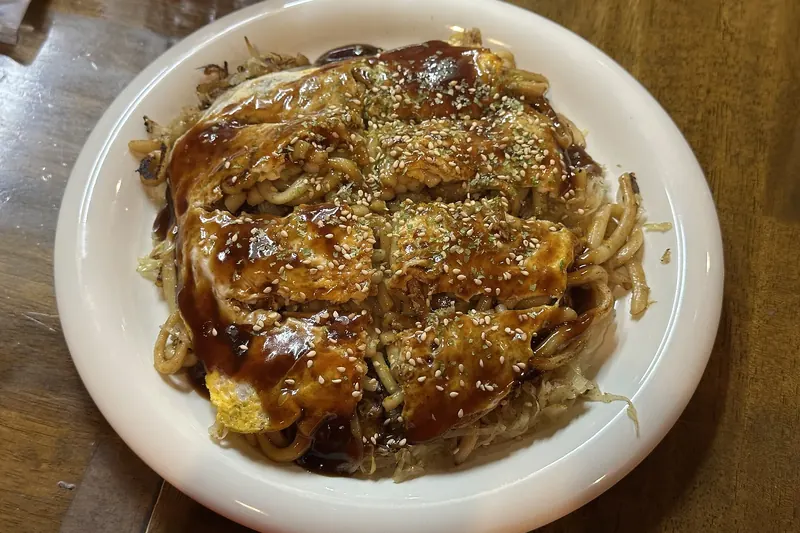 Hiroshima-style okonomiyaki, layered with noodles