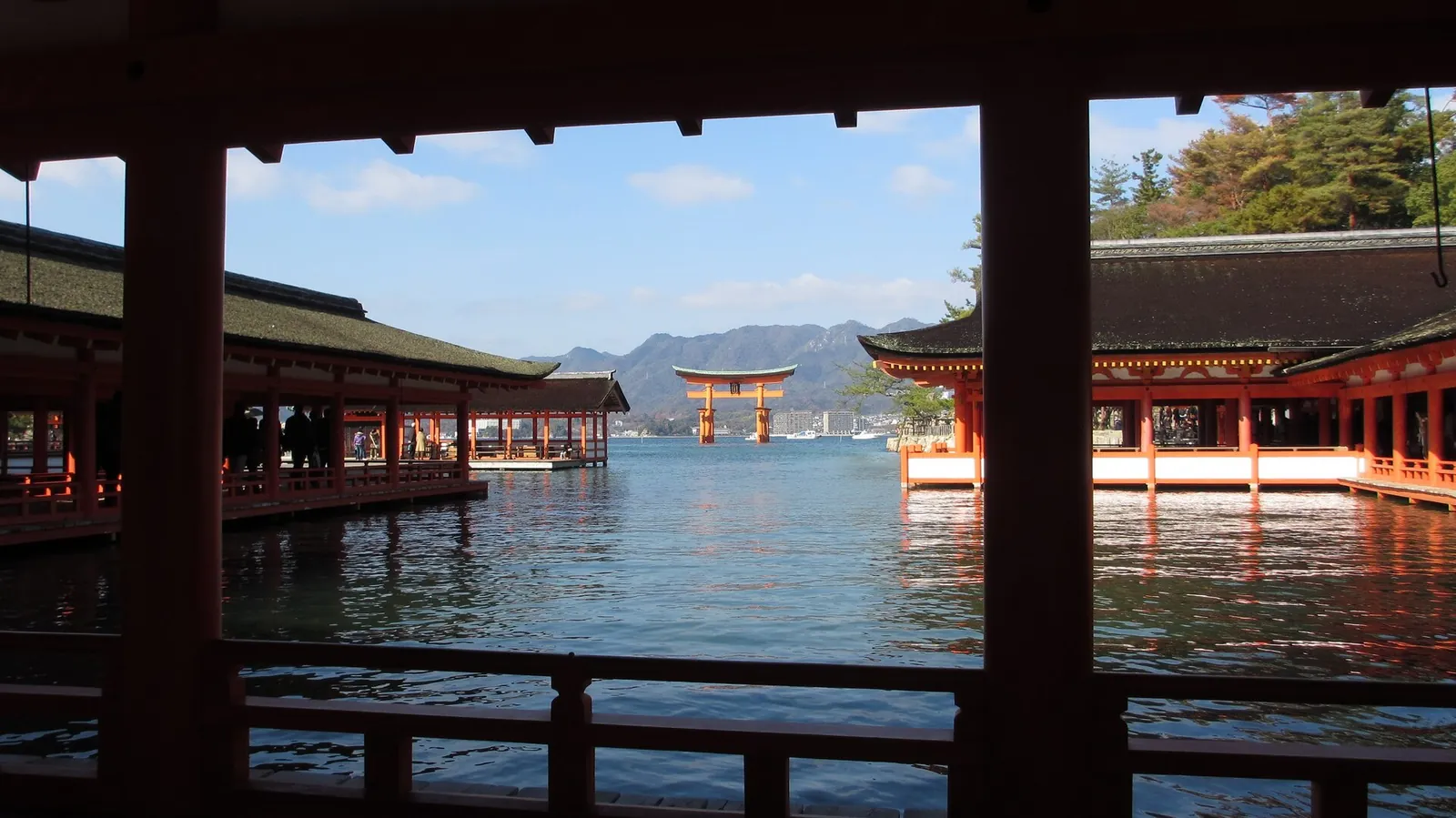 Itsukushima Shrine's vermillion torii gate appearing to float at high tide off Miyajima