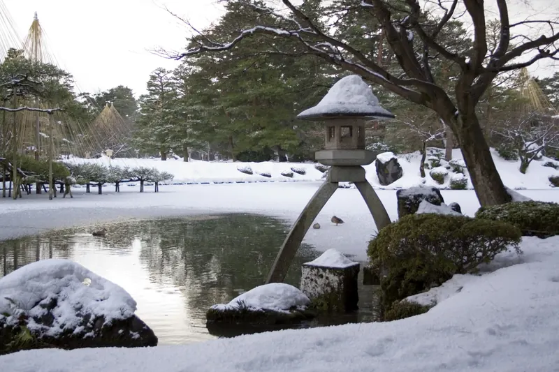 Kenrokuen Garden's stone lantern in winter snow