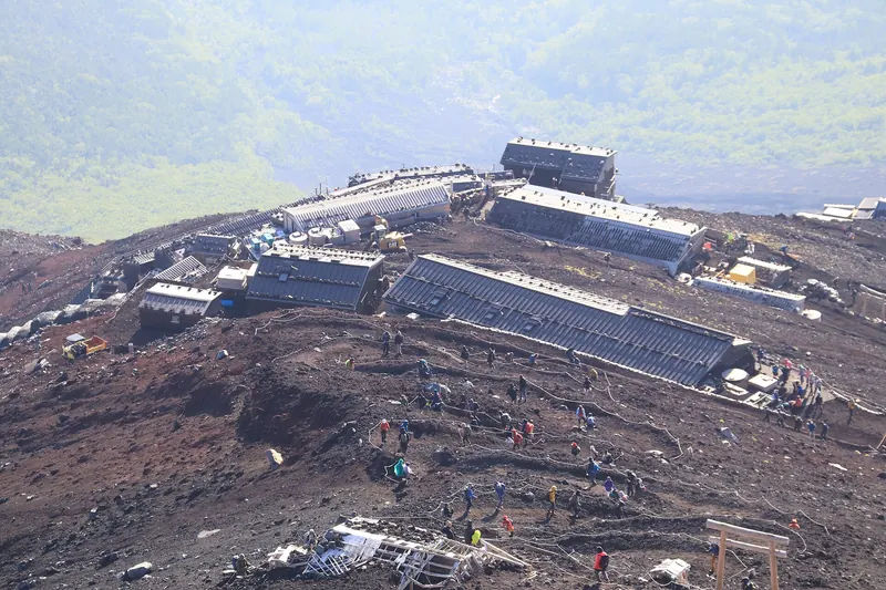 Climbers and mountain huts on Mount Fuji's Yoshida climbing route