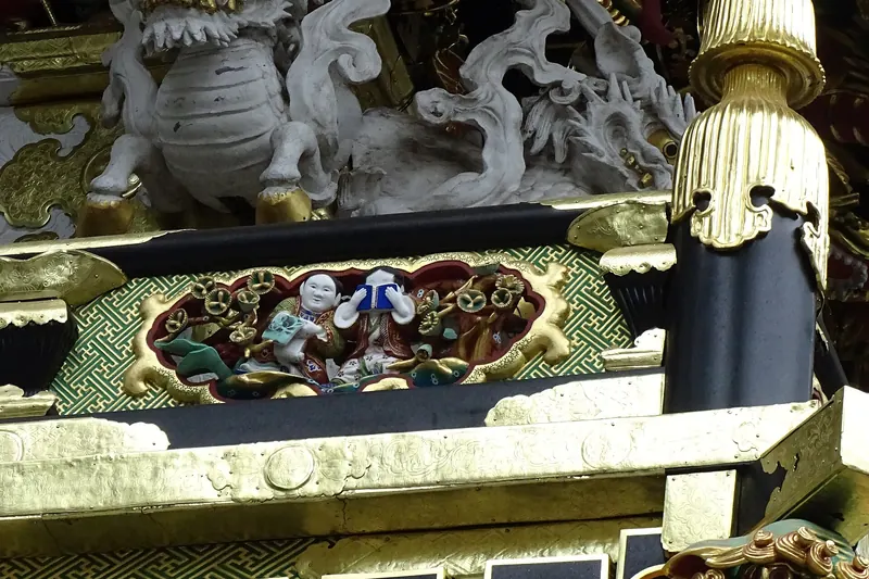 Detailed carvings and gilding on Toshogu Shrine's Yomeimon Gate