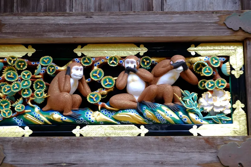The Three Wise Monkeys carving on Toshogu Shrine's sacred stable