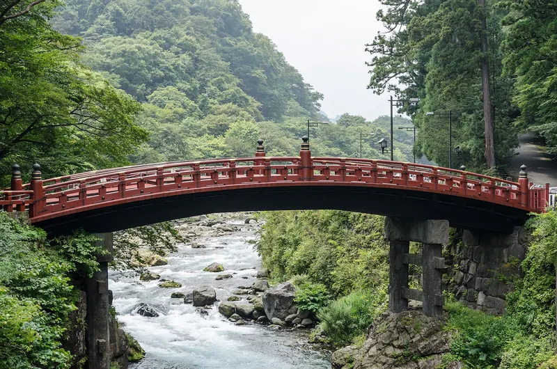 The vermillion lacquered Shinkyo Sacred Bridge over the Daiya River