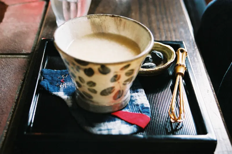 A cup of amazake, a sweet low-alcohol rice drink