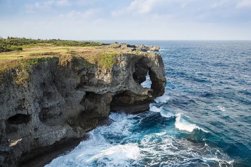 Cape Manzamo's dramatic cliff dropping into turquoise water on Okinawa's coast