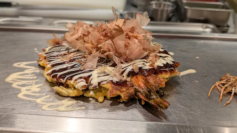 Okonomiyaki, a savoury grilled pancake, in Osaka