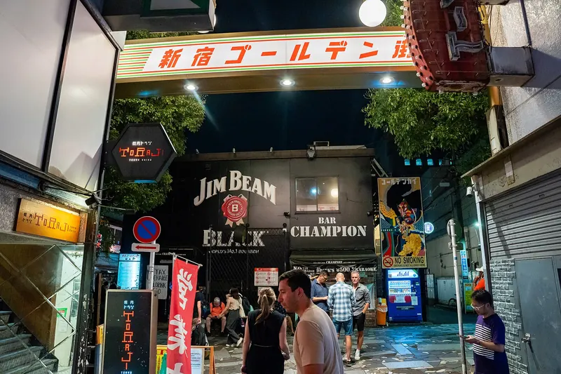 The narrow, neon-lit alleyways of Shinjuku's Golden Gai at night